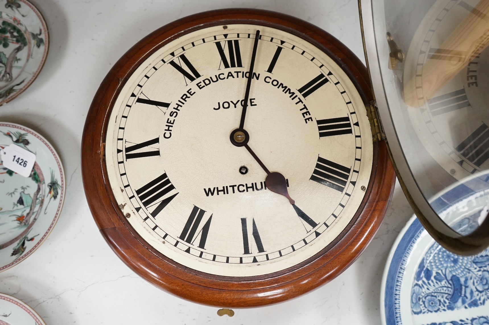 A Cheshire Education Committee wall clock by Joyce of Whitchurch, with key and pendulum, 39cm in diameter